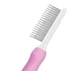 Pink pet comb with white handle on a white background
